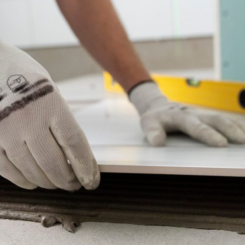 tiler-working-renovation-apartment-scaled.jpg